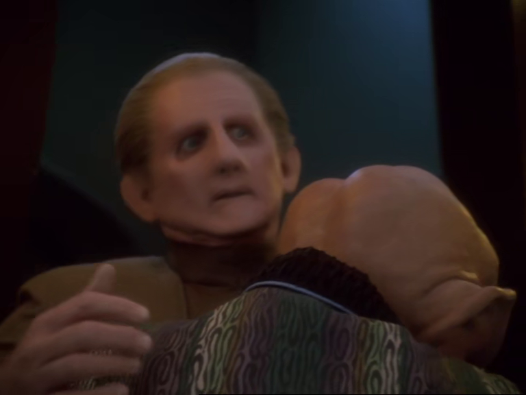 Quark hugging an uncomfortable-looking Odo